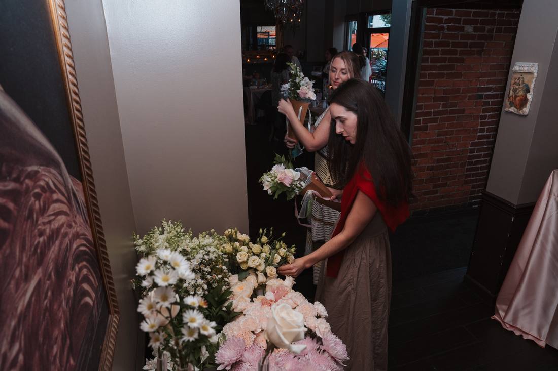 Bridal shower guests choosing stems at the Sunday Blooms flower bar